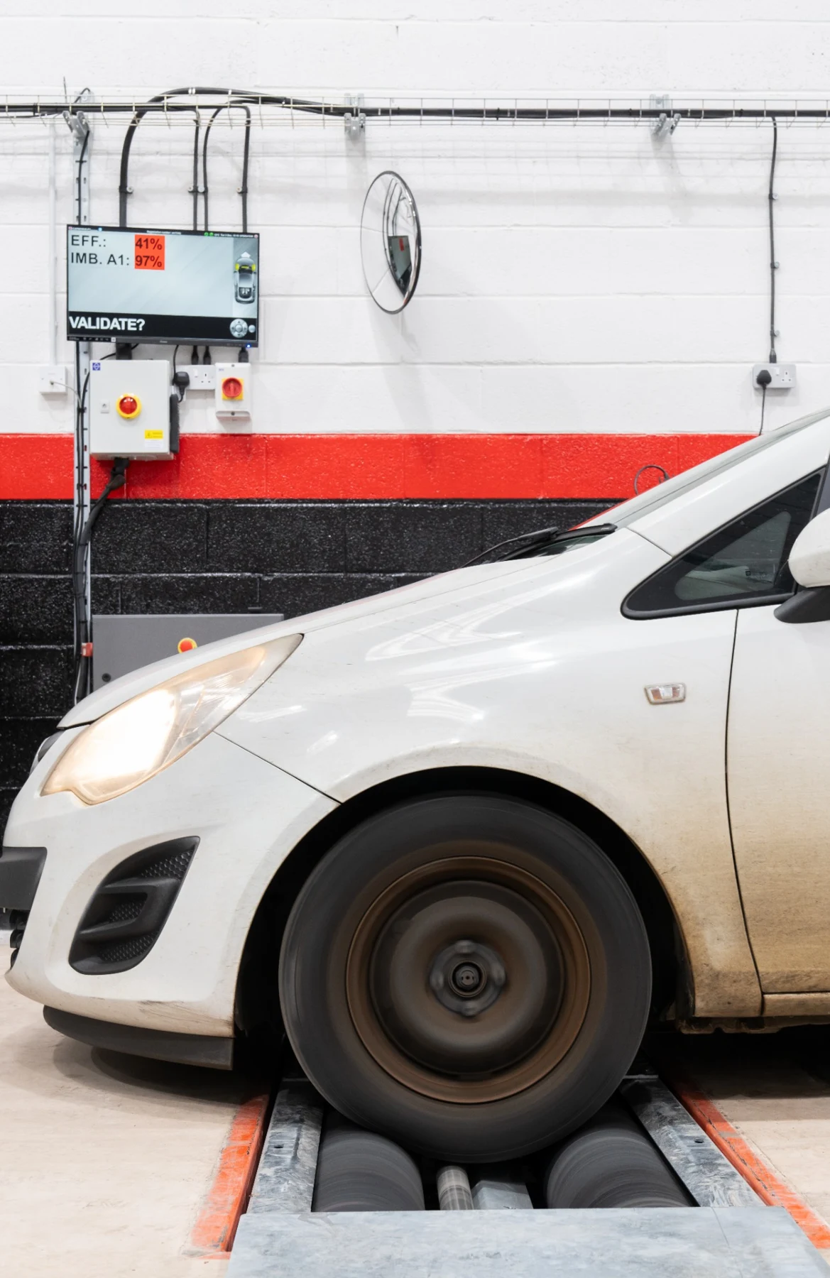 Vehicle undergoing a roller brake test in the GMS workshop