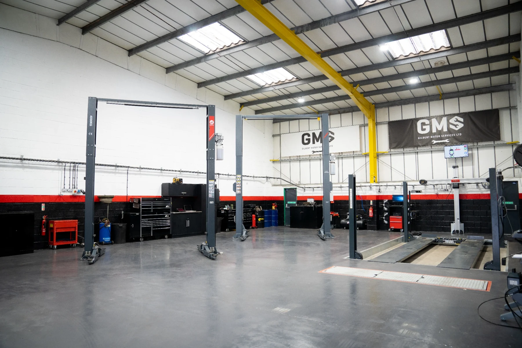 The GMS workshop with servicing lifts and MOT bay